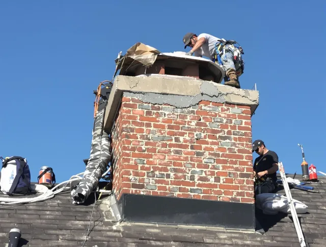 Upper Arlington Chimney Sweep installing a custom chimney crown in Upper Arlington, OH